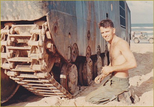 Cpl Joe McNeil fixing an Amtrac track