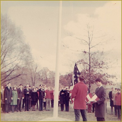 Explorer Scouts raising the US flag at the McNeil Memorial